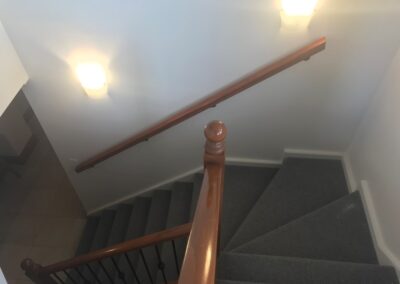 Timber handrail along staircase