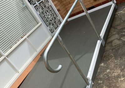 Timber ramp with galvanised banister rail