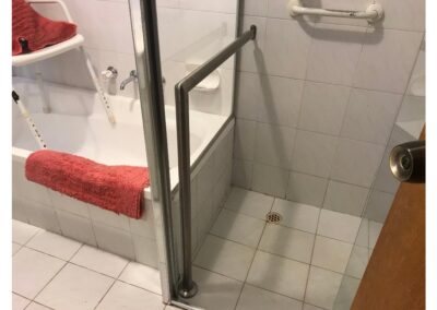 Stainless steel wall to floor rail in shower